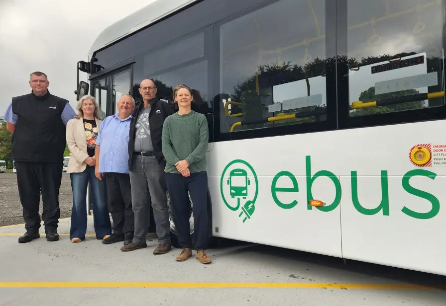 Taranaki bus staff standing outside a new ebus